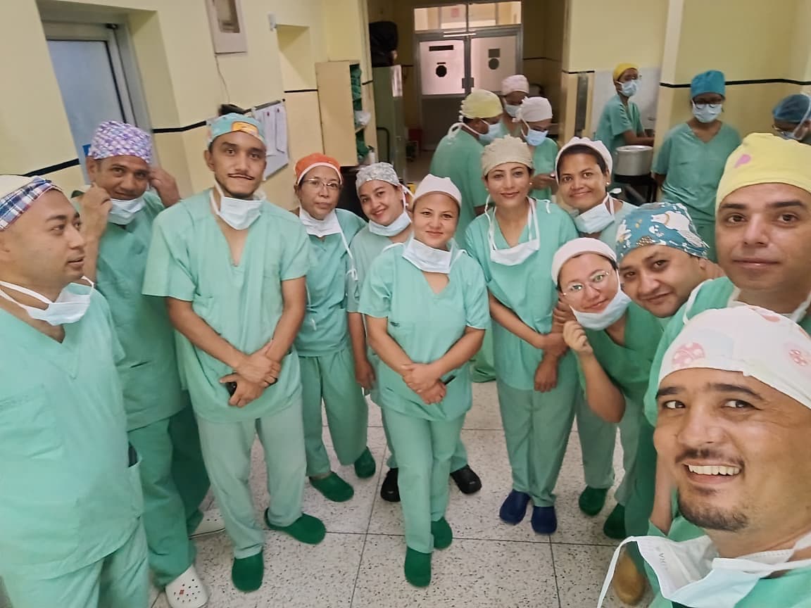 Participants in theatre scrubs ahead of the operating room visit