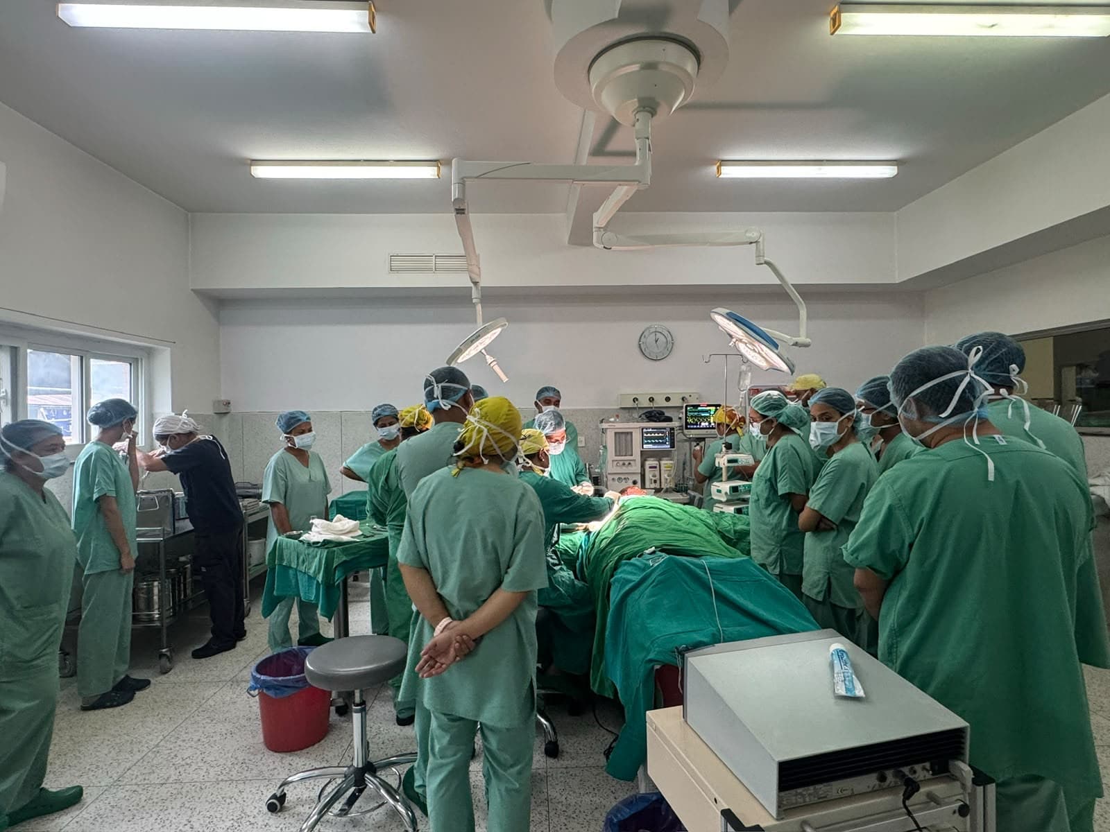 Participants observing debridement during the operating theatre visit