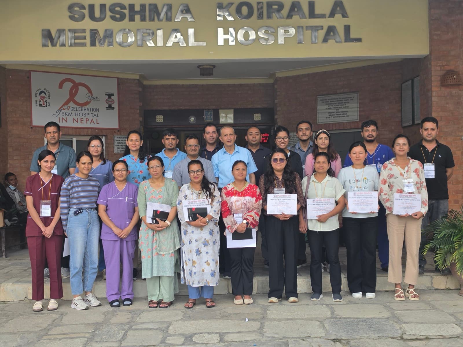 Participants and faculty in front of Sushma Koirala Memorial Hospital