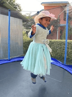 Niki playing on a trampoline