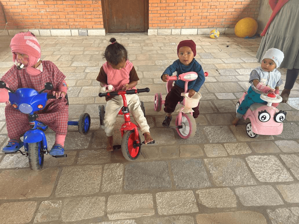 Sakhar cycling with other children